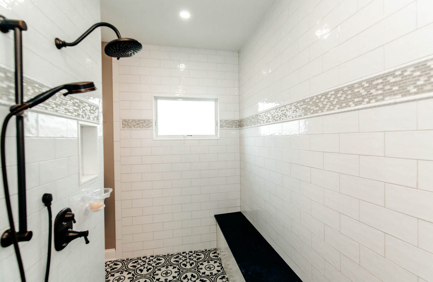a bathroom with a shower and white walls