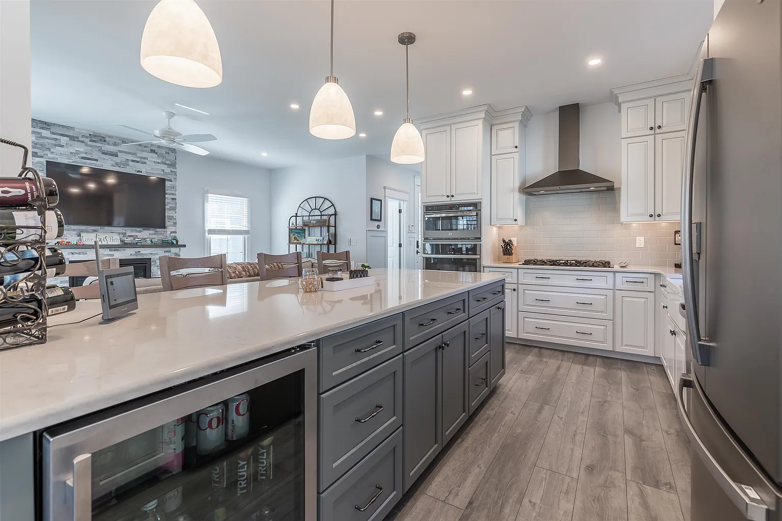 Modern kitchen island with gray cabinets.