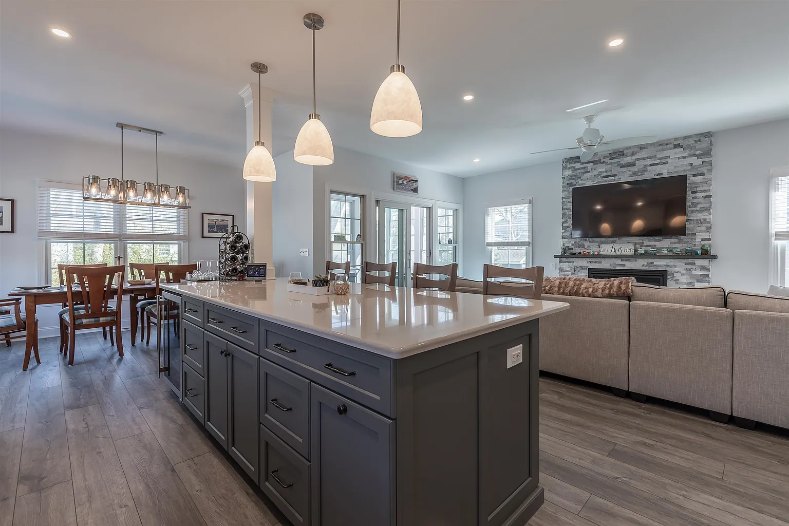 Modern kitchen island with gray cabinets.