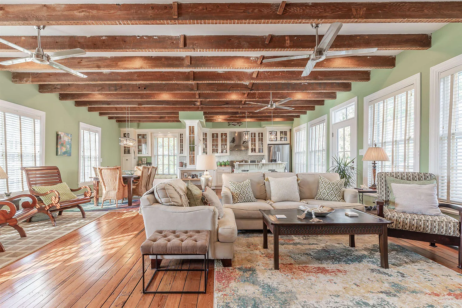 Spacious living room with exposed beams.