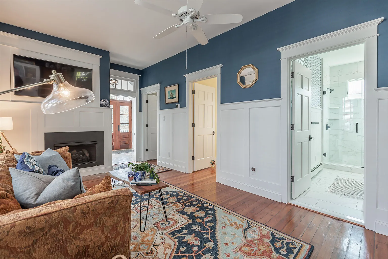 Living room with fireplace and ensuite bathroom.