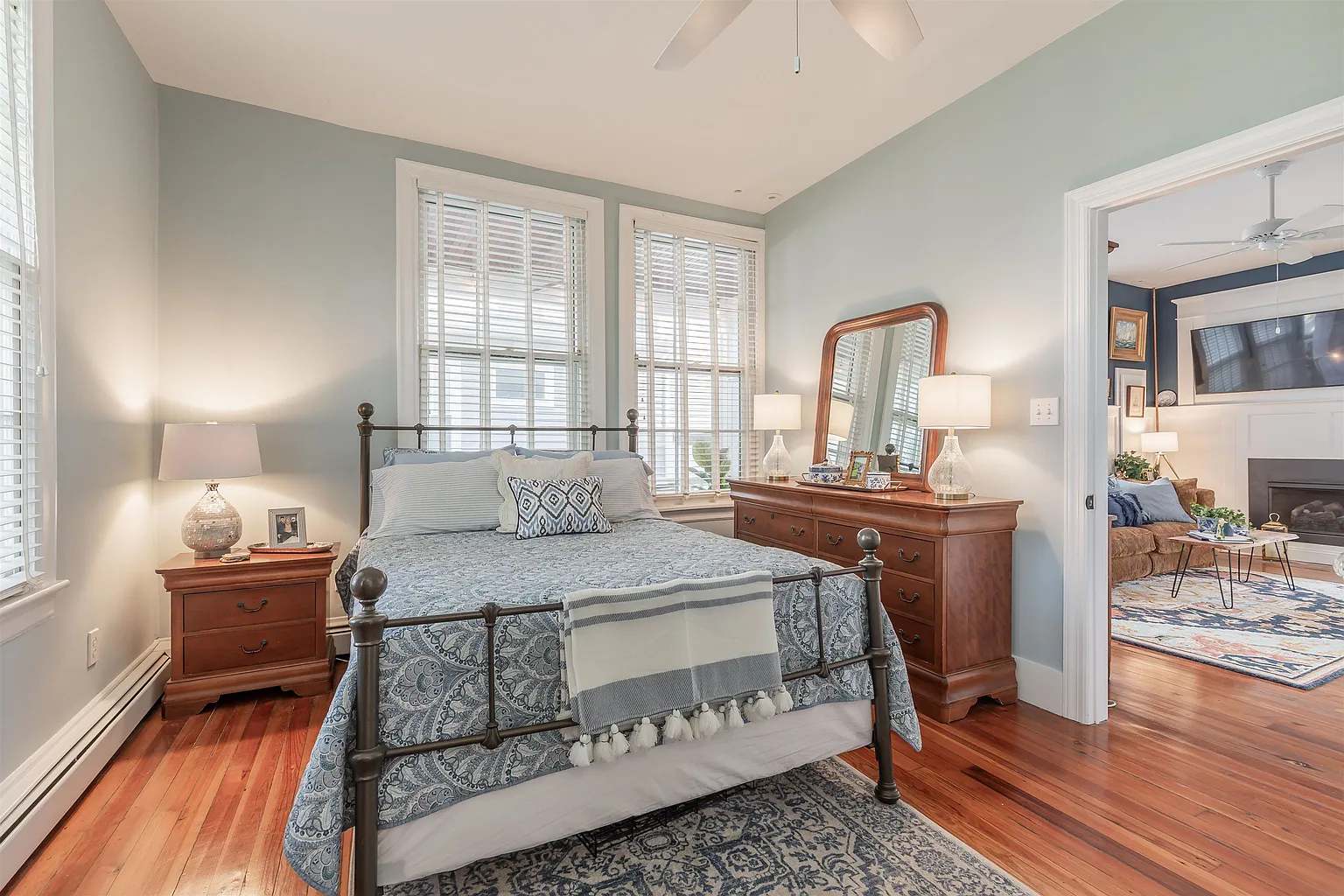 Bedroom with bed, dresser, and window.