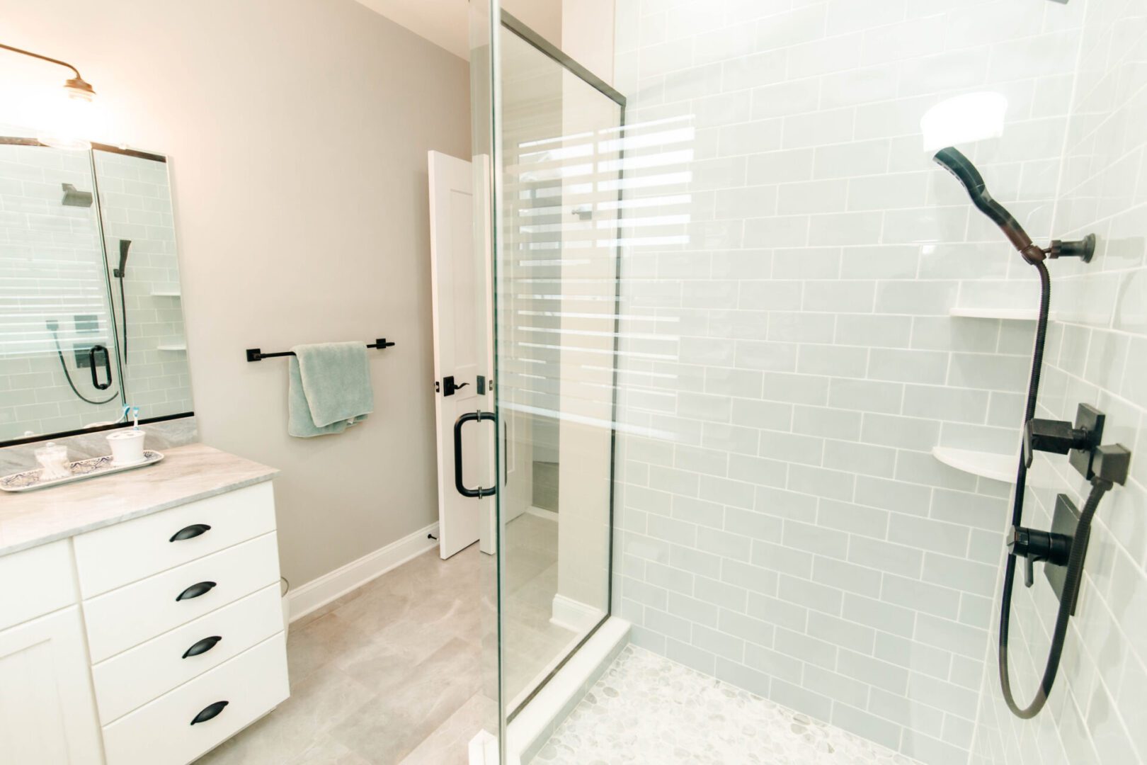 Modern bathroom with glass shower enclosure.
