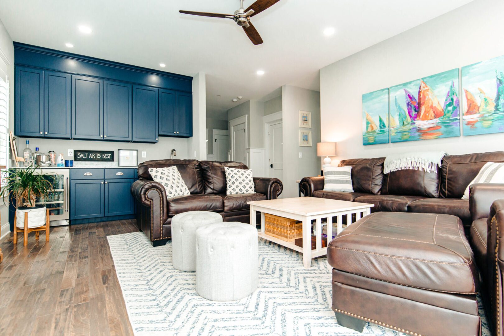 Brown leather sectional sofa in living room.