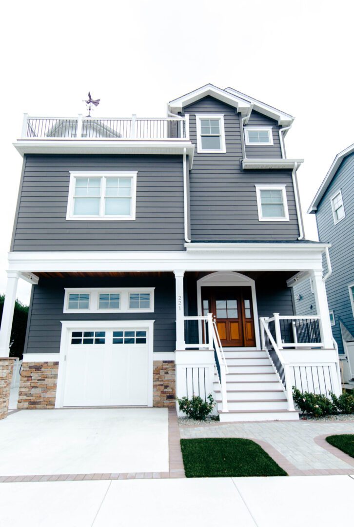 Gray house with white trim and steps.