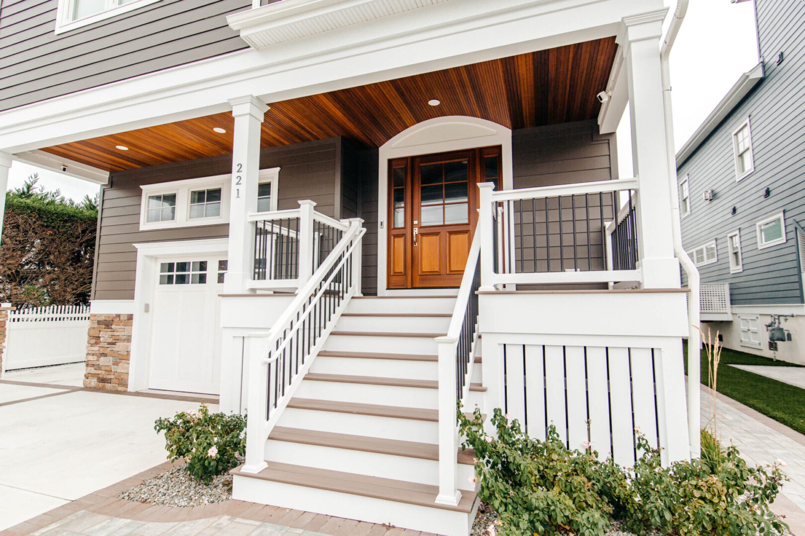House entrance with stairs and railings.