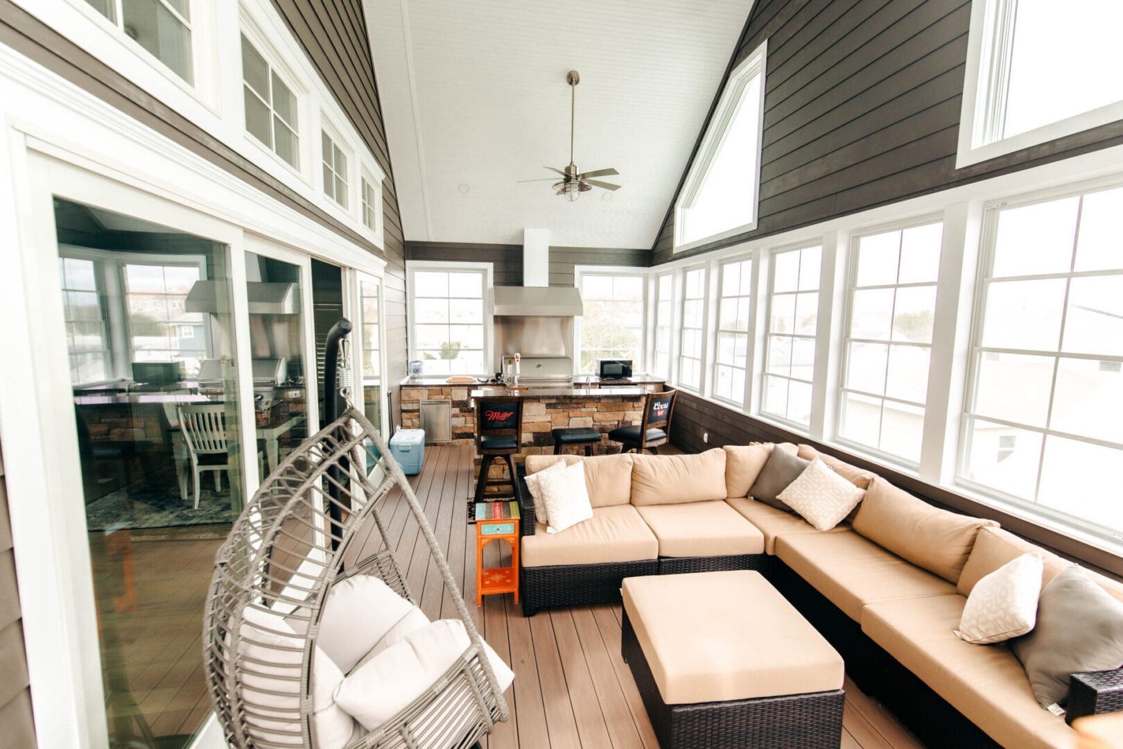 Outdoor patio with sectional sofa and grill.