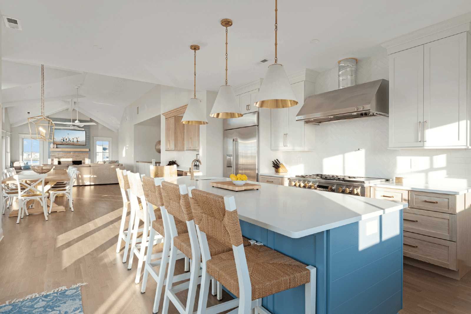 Bright kitchen island with white bar stools.