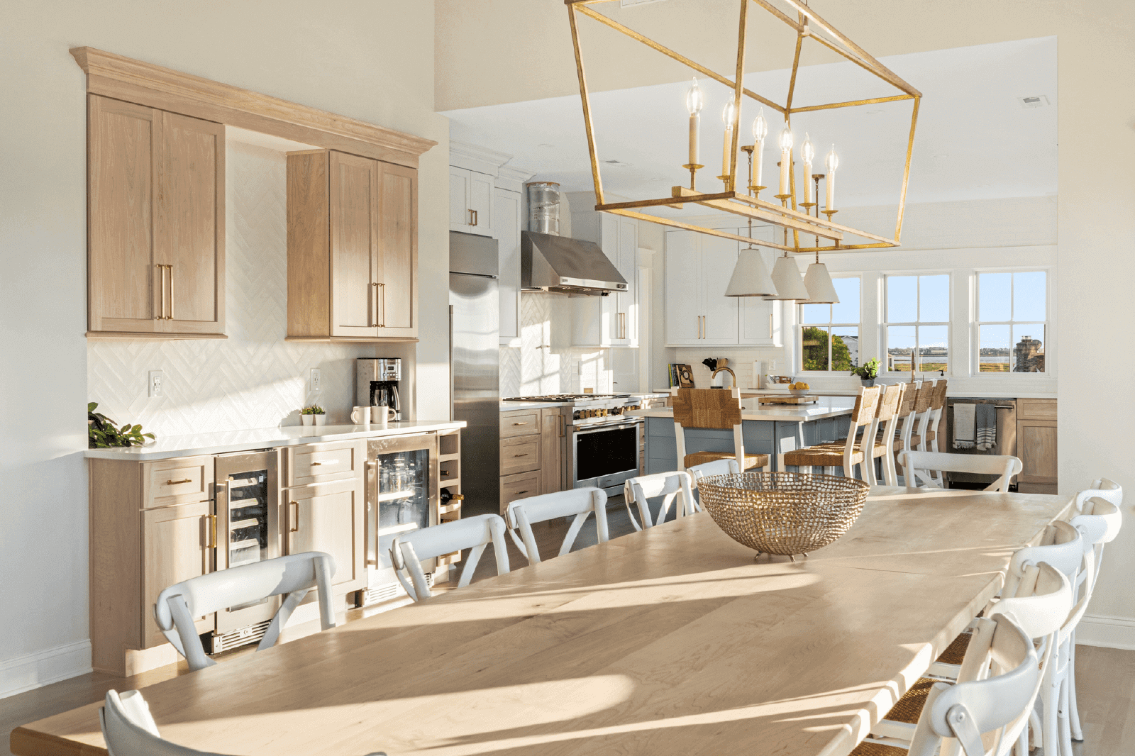 Sunlit kitchen with large dining table.
